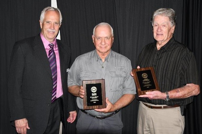 David Miller presents 50 year membership awards to Glenn Imberi and James Sheridan.